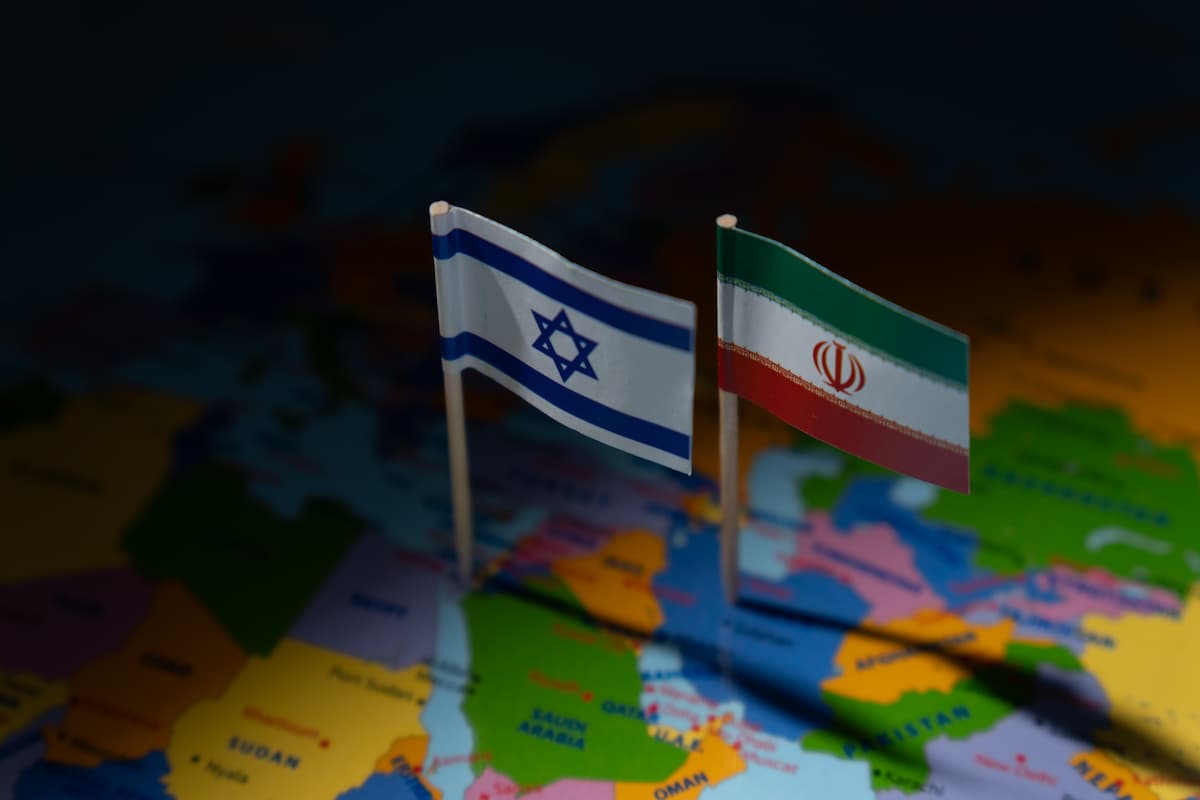 miniature-flags-israel-iran-are-planted-blurred-map-international-relations-conflict-diplomacy-geographical-focus-middle-east-concept (1).jpg